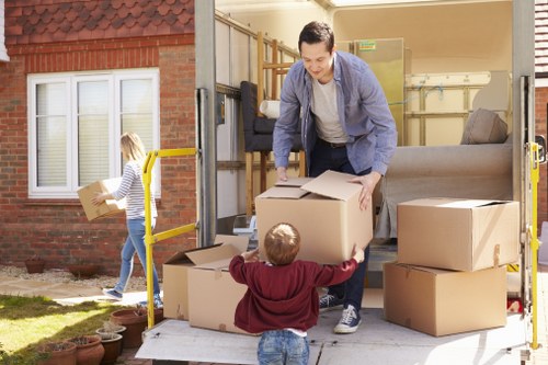 Local removals team planning a move in Bermondsey with boxes and furniture