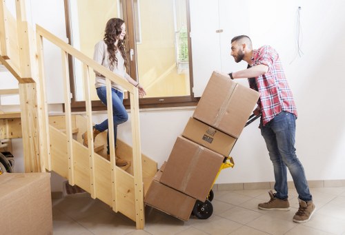 Relocation team handling desks and files in a Bermondsey office move